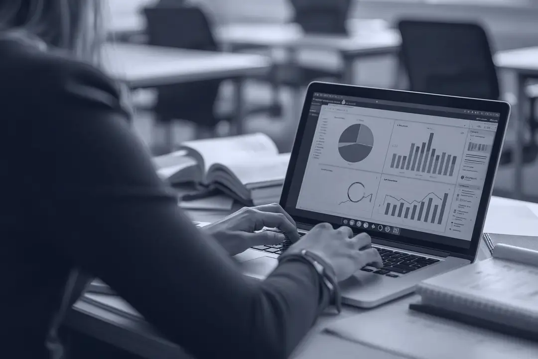 Reports with charts on a laptop in an office